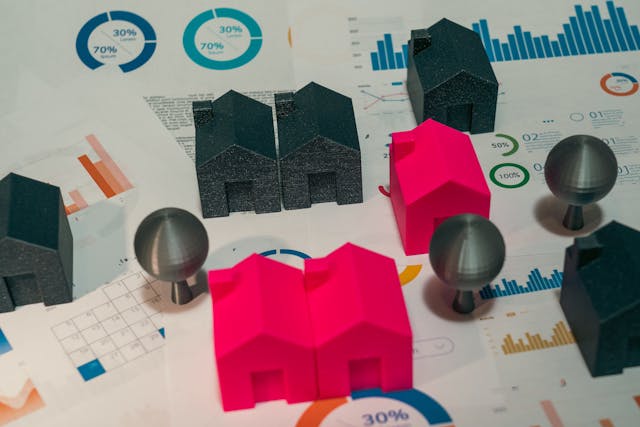 a graph with miniature houses on top