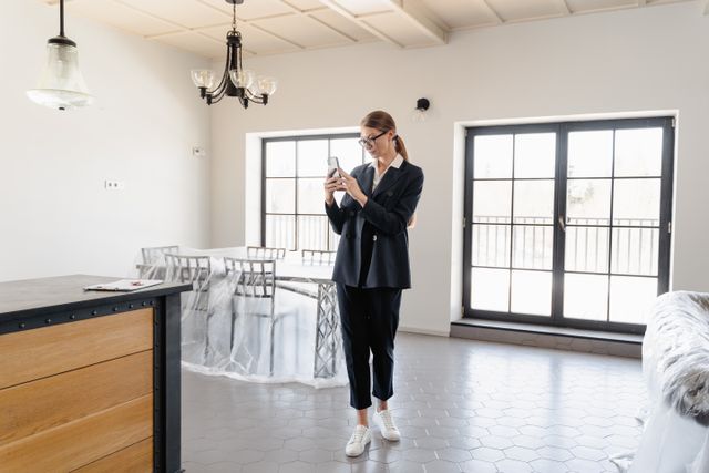 person taking a photo inside an apartment